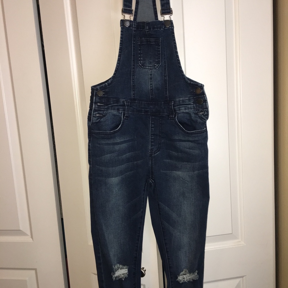 Distressed jean overalls